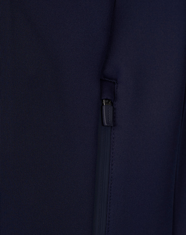 Close-up of navy Travel hoodie showing a zippered side pocket detail.
