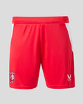 Close-up of red FC Twente home shorts waistband with crest patch on the side