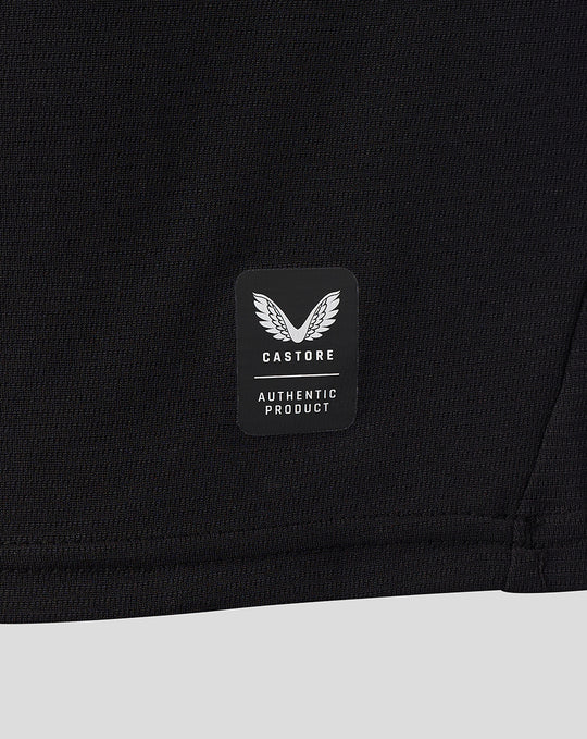 Castore authentic product badge on the lower back of the black FC Twente away shirt.