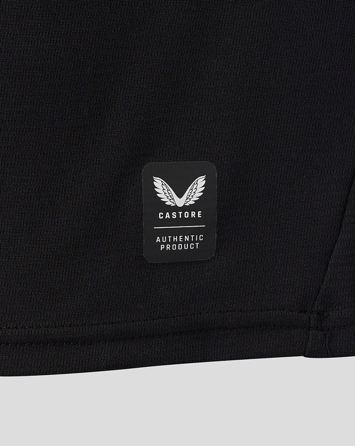 Castore authentic product badge on the lower back of the black FC Twente away shirt.