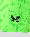 Close-up of black Castore logo on neon green printed keeper shorts.