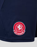 Close-up of navy FC Twente Vierde Short fabric with red crest patch.