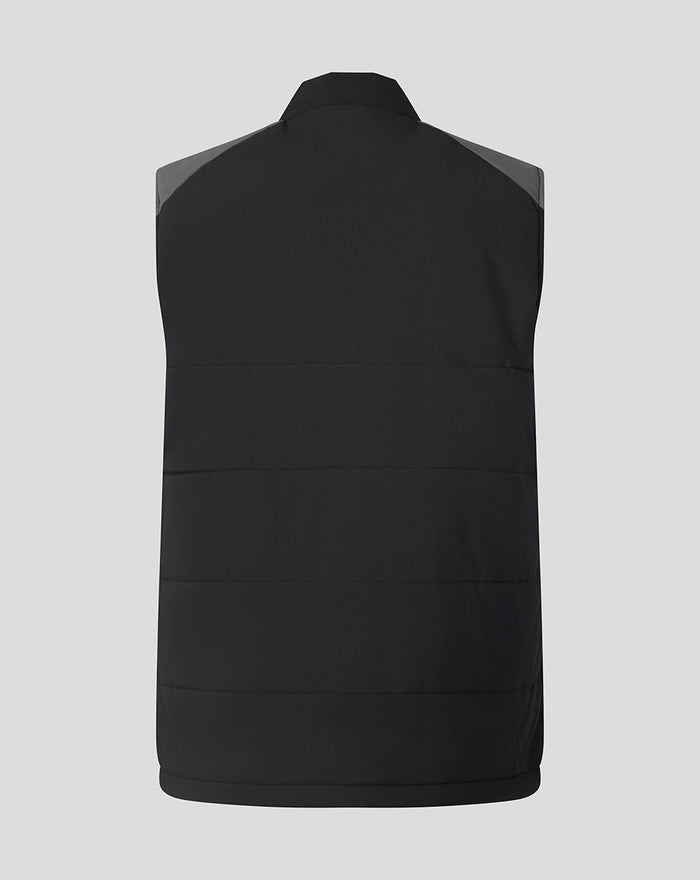 Back view of a black FC Twente Training gilet with horizontal quilting and grey shoulder panels.
