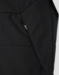 Close up of black FC Twente training gilet detailing a diagonal zip pocket and quilted panels
