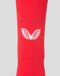 Red FC Twente footless home sock knit texture with a white logo visible on the lower leg