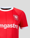 Close up of red FC Twente women's home shirt showing crest on the chest and large sponsor text across the front