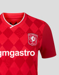 Close-up of FC Twente women's home shirt 25/26 showing red diamond pattern white V-neck collar crest on chest and sponsor across front.