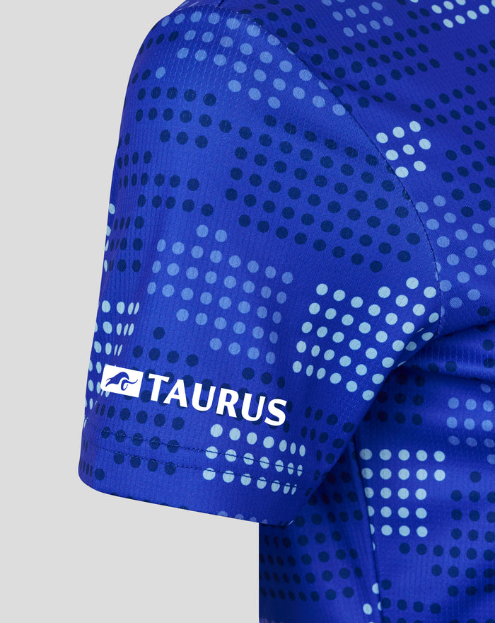 Close up of FC Twente 25/26 women's away shirt in blue with a dotted pattern and Taurus sponsor logo.