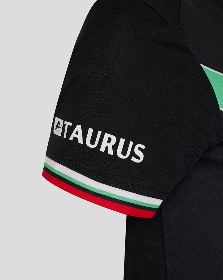 Close up of black women's FC Twente third shirt sleeve with Taurus branding and red white green trim.