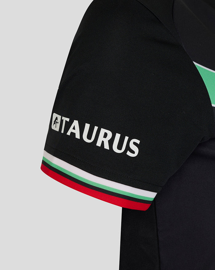 Close up of black women's FC Twente third shirt sleeve with Taurus branding and red white green trim.