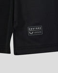 Close-up of the shirt hem featuring a Castore patch with serial number