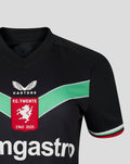 Close-up of the black women's FC Twente third shirt showing the crest and green chevron across the chest
