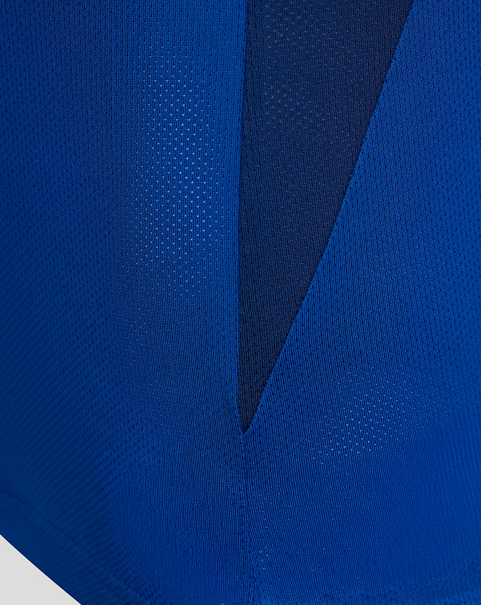 Closeup of blue textured fabric and panel details from the FC Twente Pro Coach Training Shirt