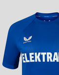 Shoulder and chest close-up of blue women's FC Twente training shirt showing crest and Castore branding