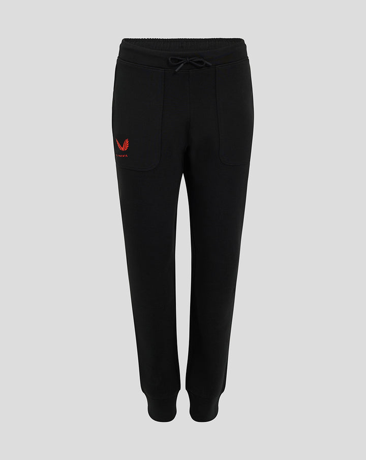Front view of black FC Twente Travel Pants for women with red Castore wings and club crest on the thigh and drawstring waist