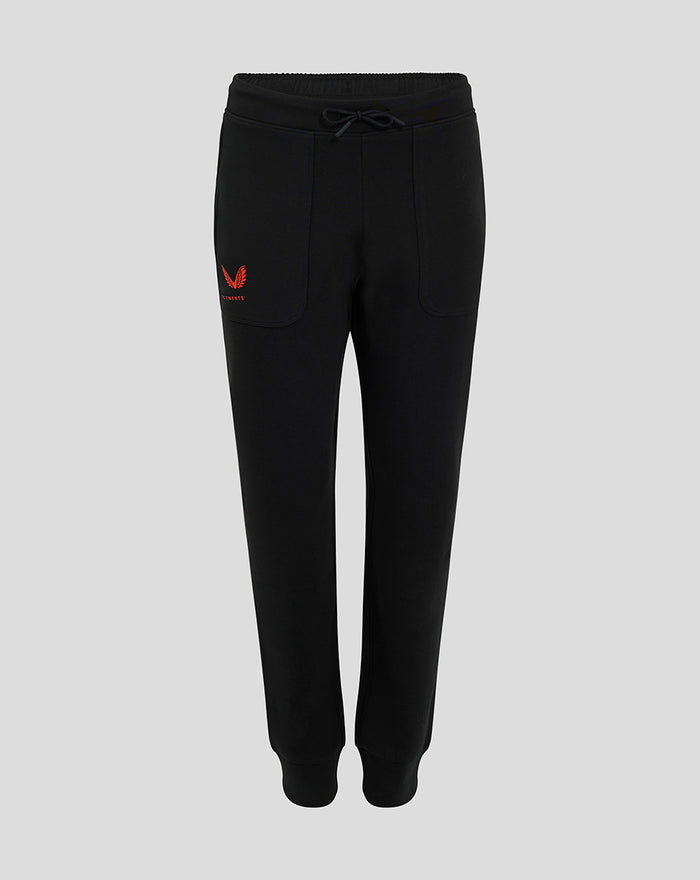 Front view of black FC Twente Travel Pants for women with red Castore wings and club crest on the thigh and drawstring waist