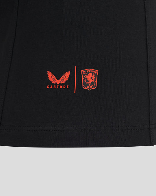 Close up of red Castore wings and FC Twente crest on black Travel T shirt fabric