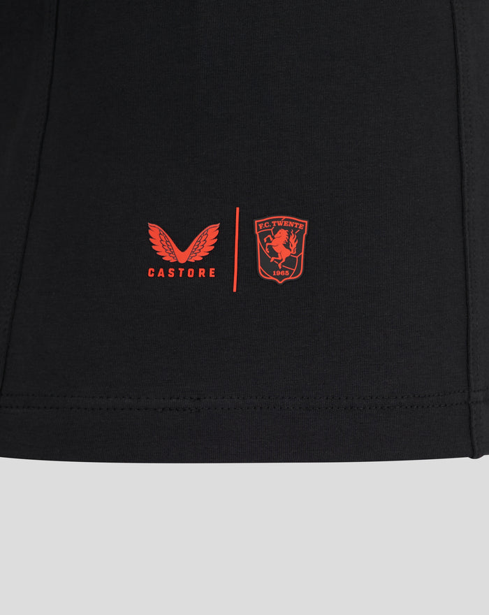 Close up of red Castore wings and FC Twente crest on black Travel T shirt fabric