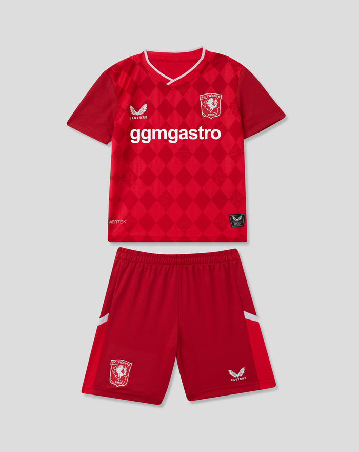 Front view of red FC Twente 25/26 kids home jersey with diamond pattern crest and sponsor logo