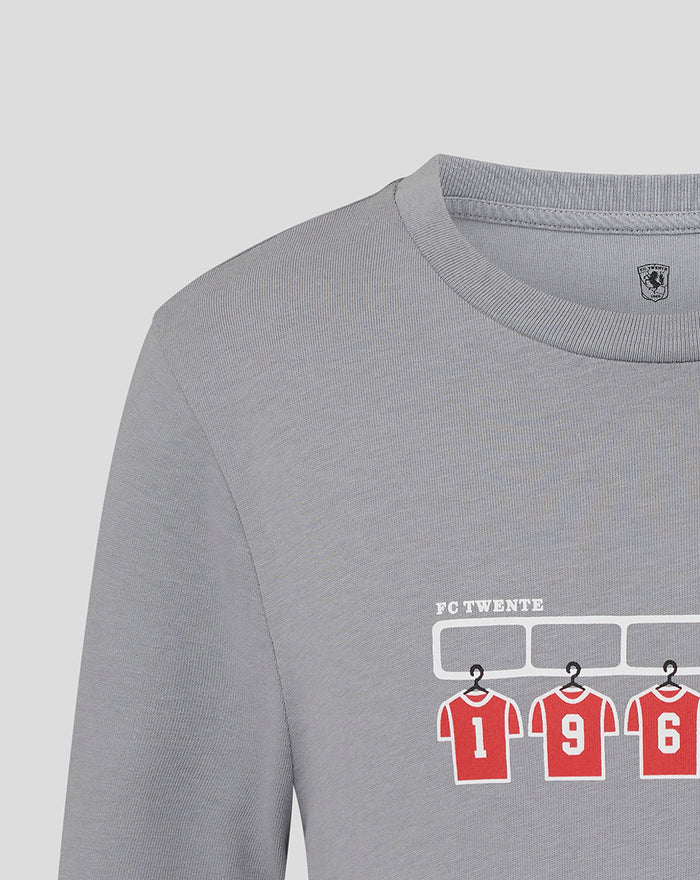 Grey T shirt with FC Twente graphic of red numbered jerseys under a white rack