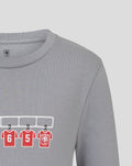 Grey FC Twente dressing room T shirt with red numbered jerseys hanging on a rack