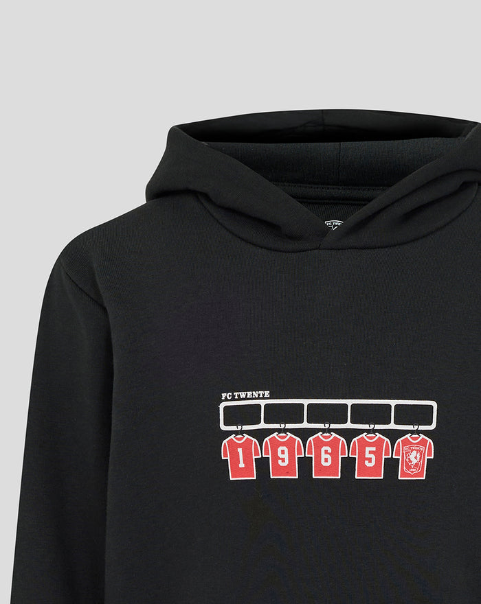 Detail of chest print on black FC Twente hoodie with red numbered jerseys and crest