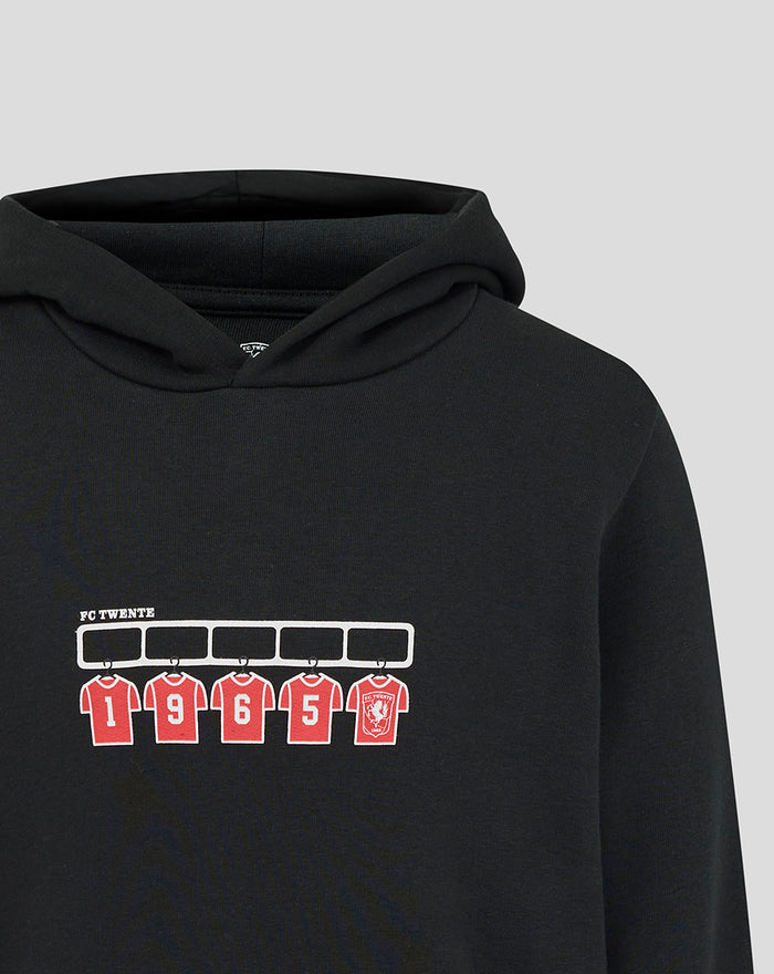 Close up of chest print on black FC Twente hoodie showing white rack and red numbered jerseys