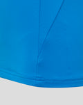 Close-up of blue fabric and seam details on the FC Twente junior midlayer top.