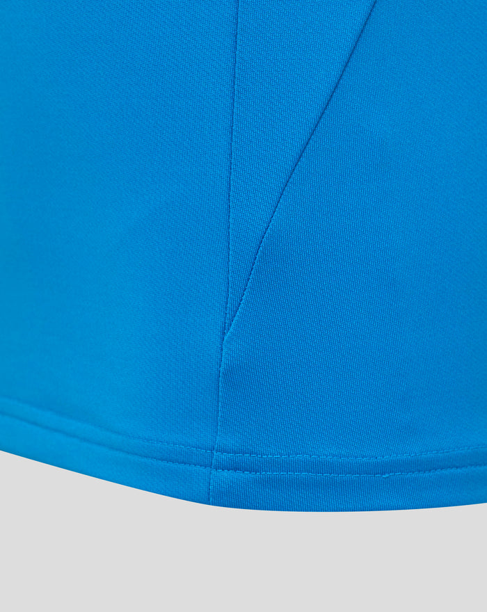 Close-up of blue fabric and seam details on the FC Twente junior midlayer top.