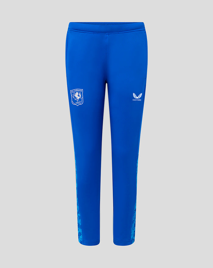Front view of blue FC Twente junior performance pants with club crest on left leg and Castore logo on right leg.