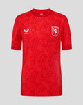Red FC Twente matchday junior T shirt front view with club crest and Castore logo.