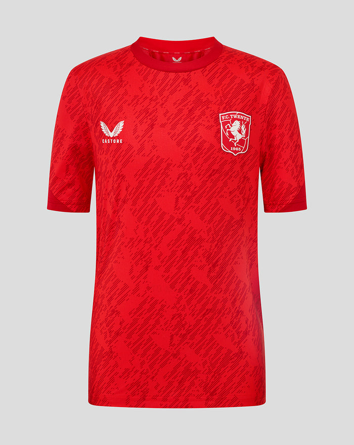 Red FC Twente matchday junior T shirt front view with club crest and Castore logo.