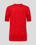 Back view of red FC Twente matchday junior T shirt with allover printed pattern.