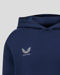 Close-up of the navy hoodie showing the hood and Castore logo with wings on the chest.