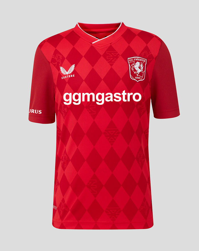 FC Twente home shirt 25/26 junior red diamond pattern with club crest on left chest and ggmastro sponsor across front