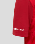 Close-up of the red FC Twente home shirt sleeve with Taurus branding on the cuff and diamond pattern.