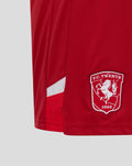 Red FC Twente junior home shorts fabric with the club crest patch