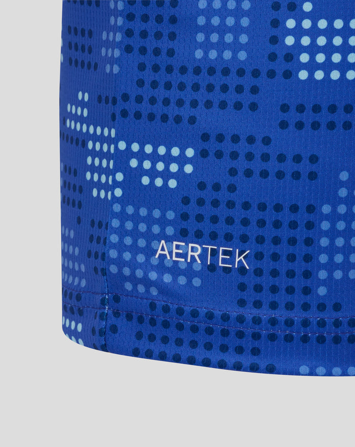 Close up of blue FC Twente shirt fabric showing a dotted pattern and AerTek branding