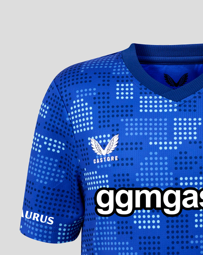 Shoulder and collar of FC Twente 25/26 junior jersey showing blue dotted design