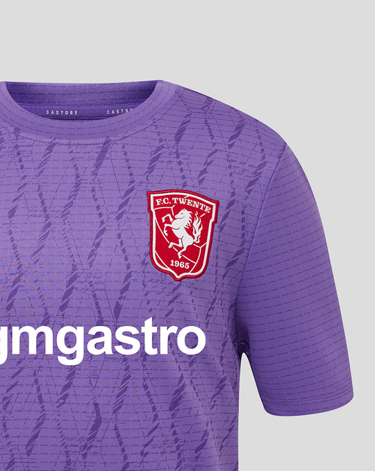 Close up of purple FC Twente junior keepers shirt showing crest on chest and large white graphic text across the front.