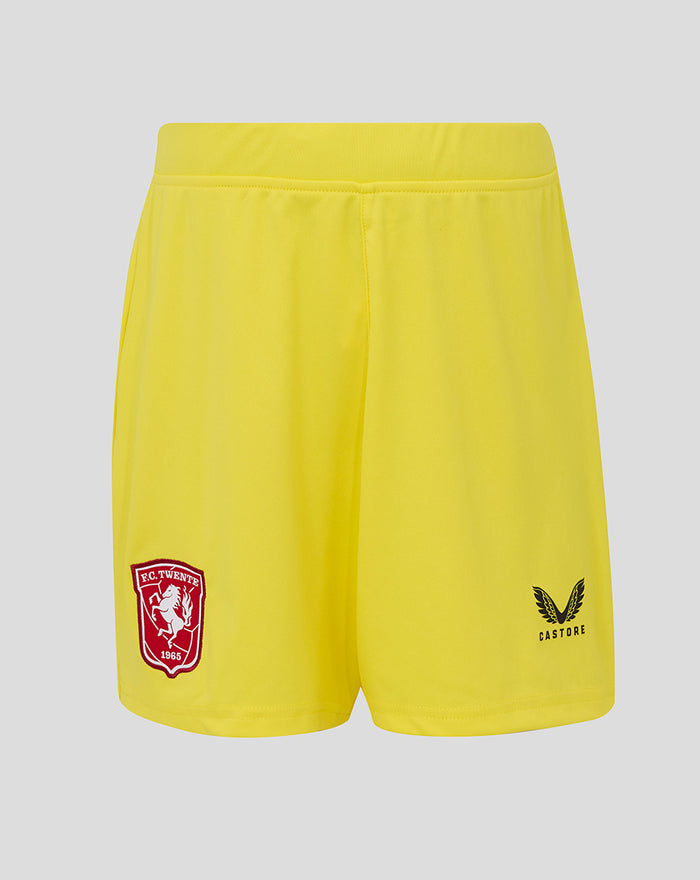 Yellow junior FC Twente keeper shorts with red team crest on left leg and Castore logo on right.