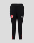 Black junior FC Twente matchday pants with the club crest on the thigh and Castore logo and red side panels