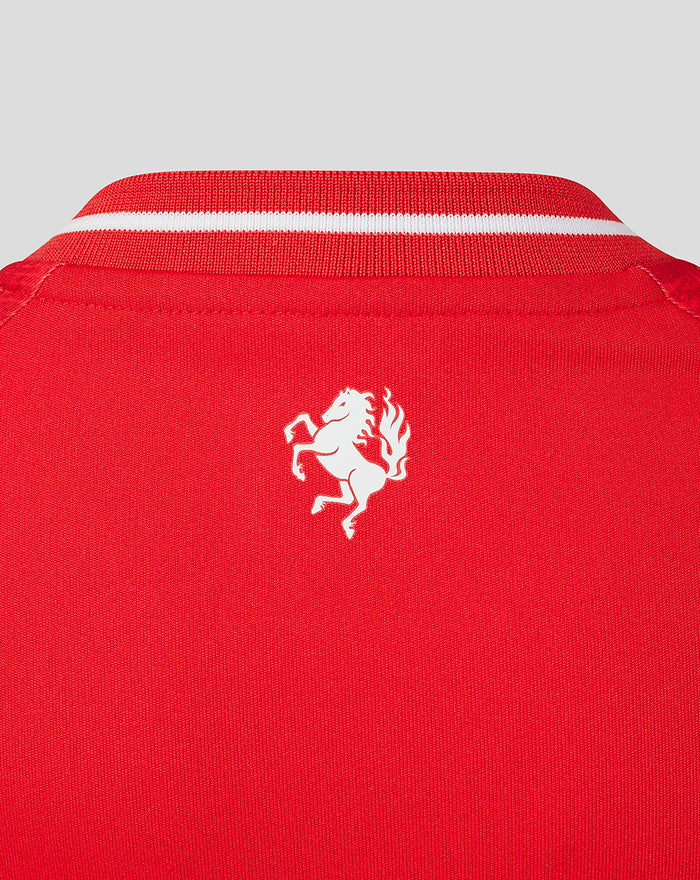 Close up of the red FC Twente home shirt neck with white trimmed V neck