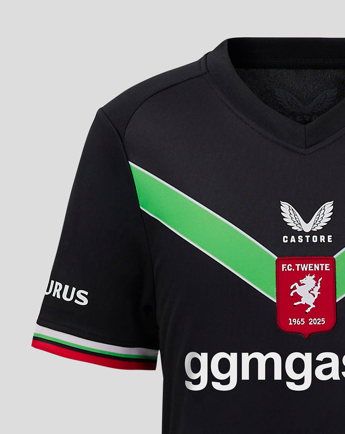 Front view of FC Twente third shirt 25/26 junior featuring green chevron red crest and large ggmastro sponsor across the chest.