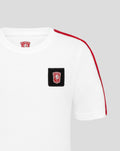 Close up of FC Twente junior white cotton T-shirt showing a black patch crest on chest and black shoulder stripe