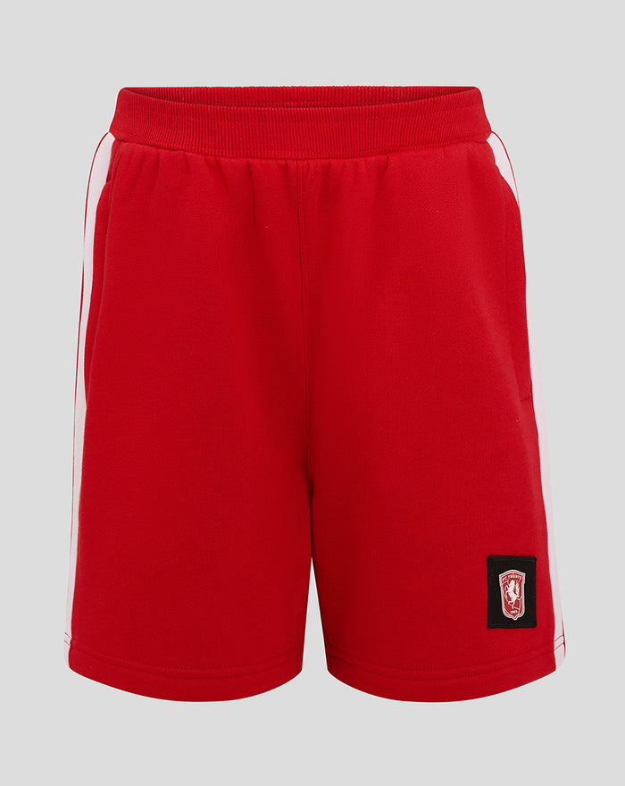 Bright red FC Twente junior shorts with white side piping and crest badge on the leg.
