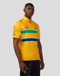 Male model wearing yellow McLaren Senna Monaco polo with bold green white navy stripes across chest