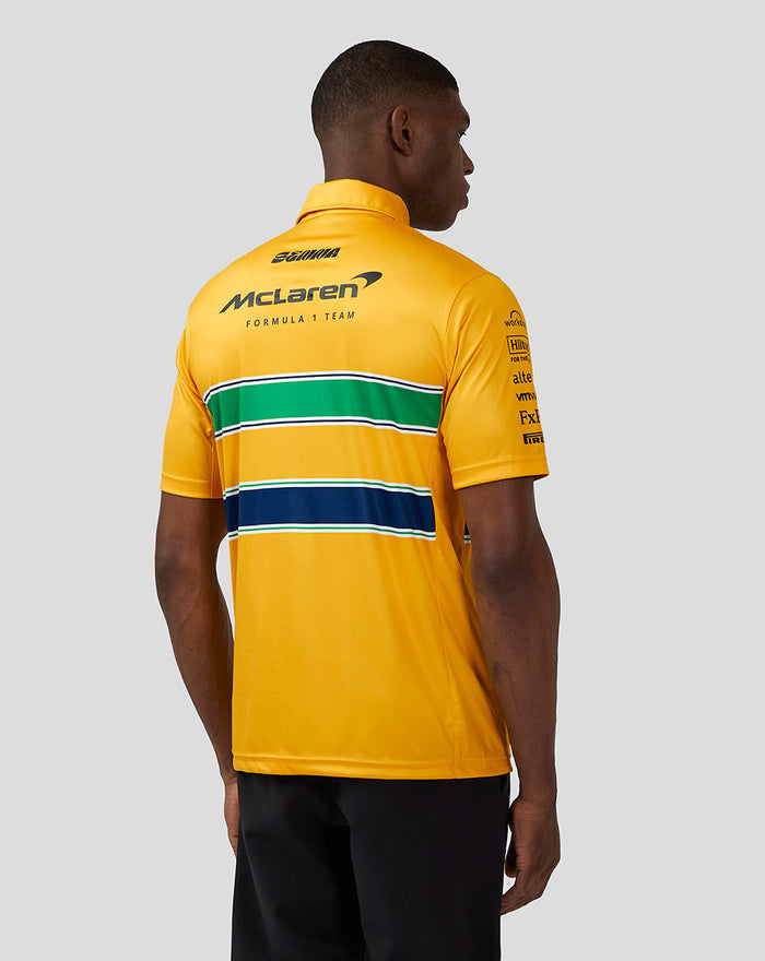 Back view of yellow McLaren Senna Monaco polo featuring sponsor logos and green white navy stripes