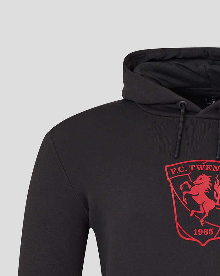Close up of crest on chest of black FC Twente Core hoodie