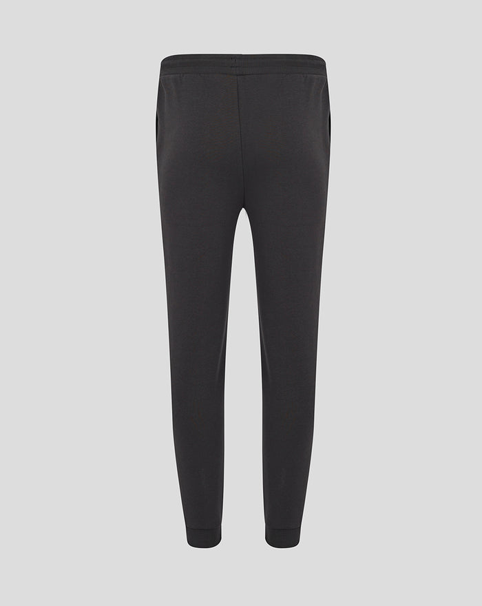 Back view of black FC Twente Core jogging pants for men showing a central seam and ribbed cuffs